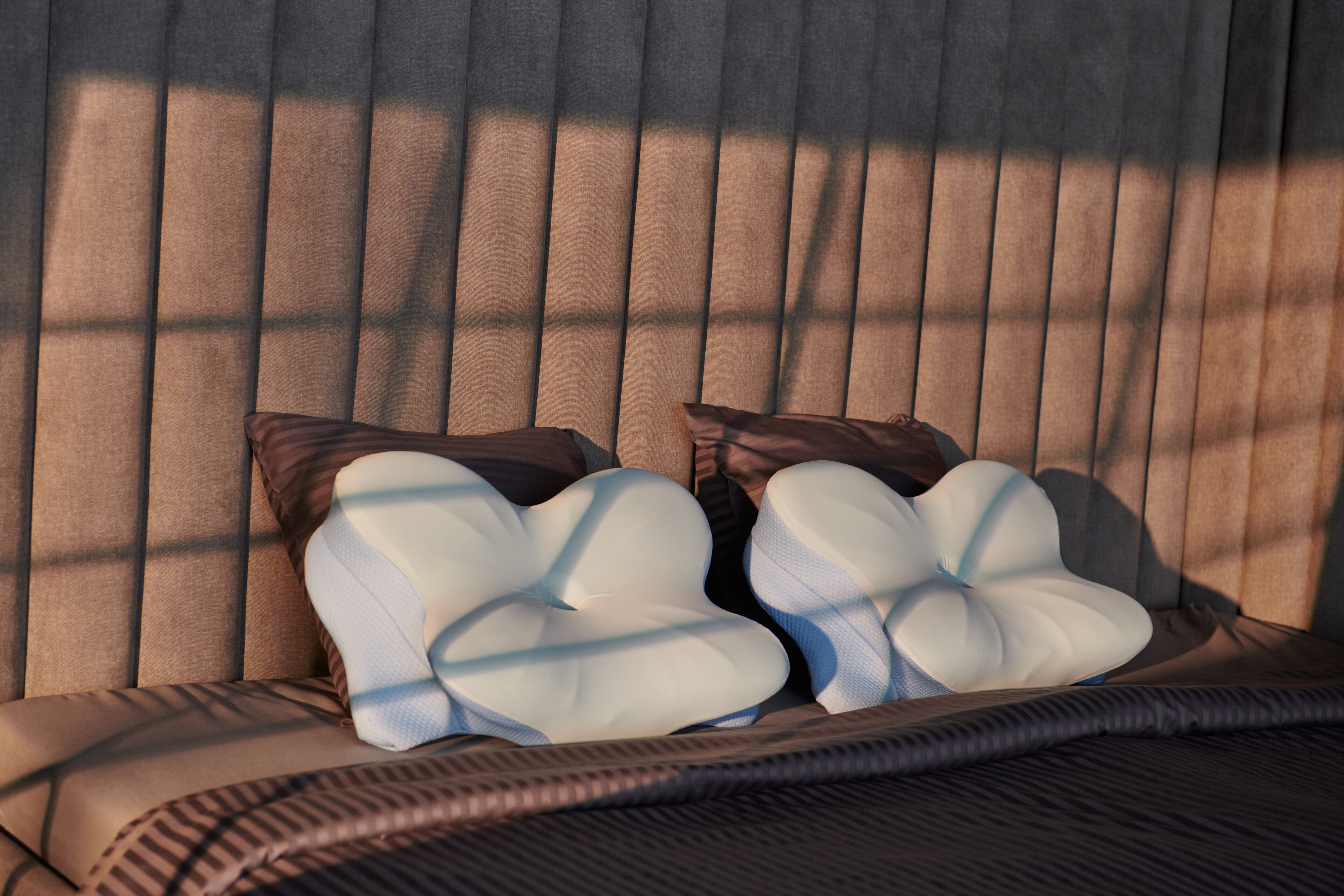 Derila pillows showing their distinctive contoured shape