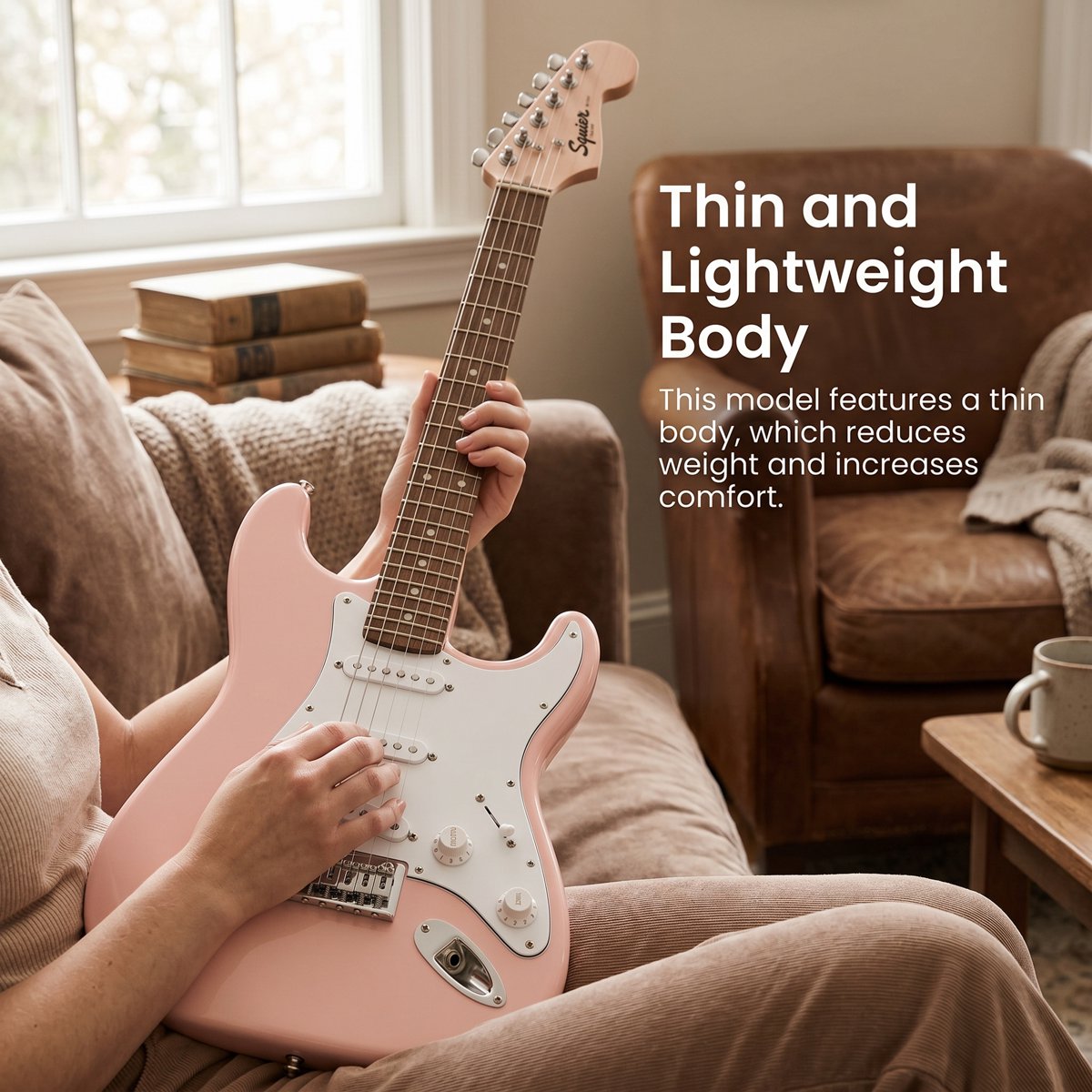 A smaller player holding the Shell Pink Mini Stratocaster